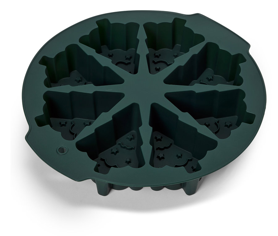 Közeli kép egy zöld színű szilikon jégkockaformáról, denevér és fa motívumokkal.