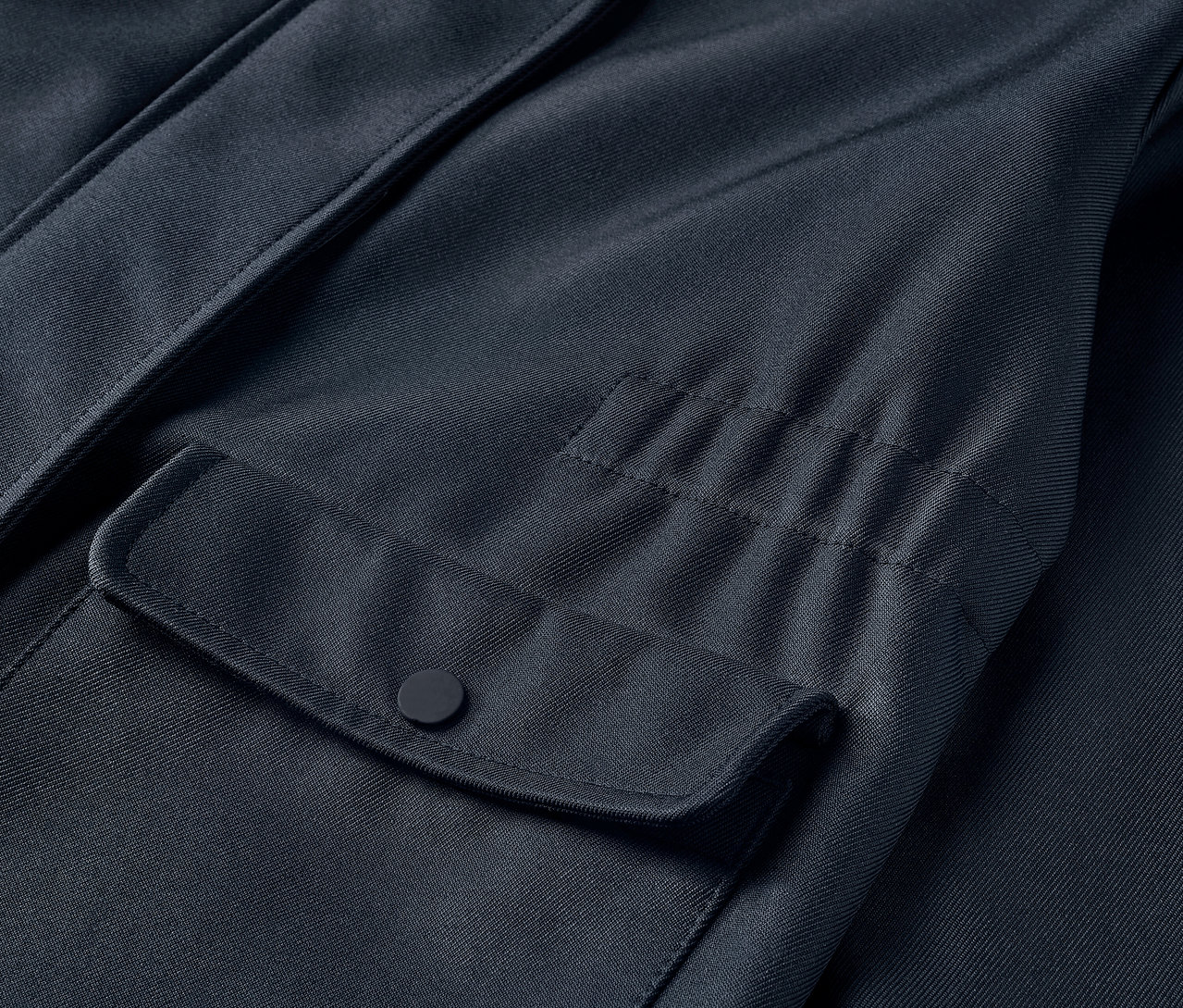 Egy gyerek softshell kabát részlete, zsebbel.