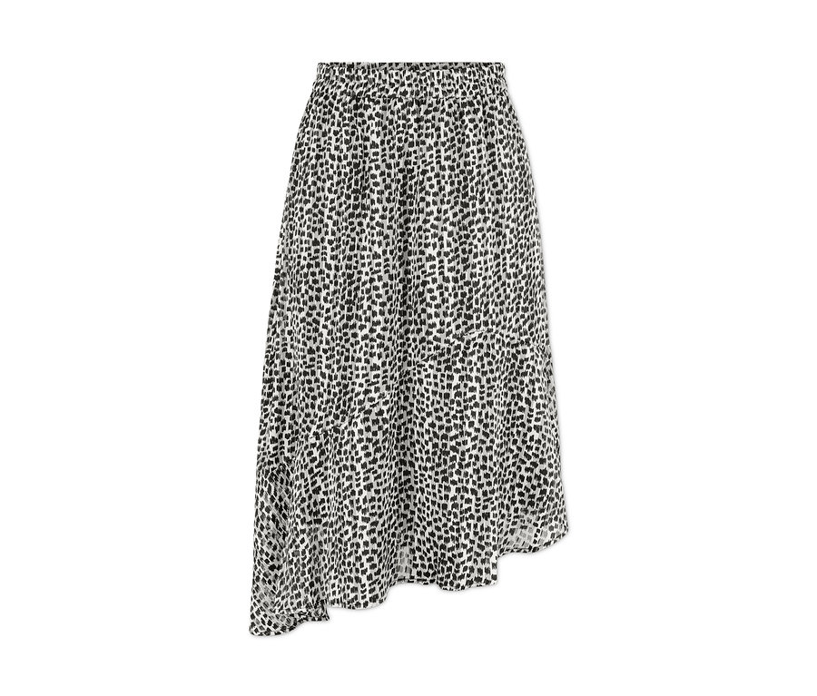 Egy női aszimmetrikus szoknya részlete, fekete nyomattal, fehér alapon.