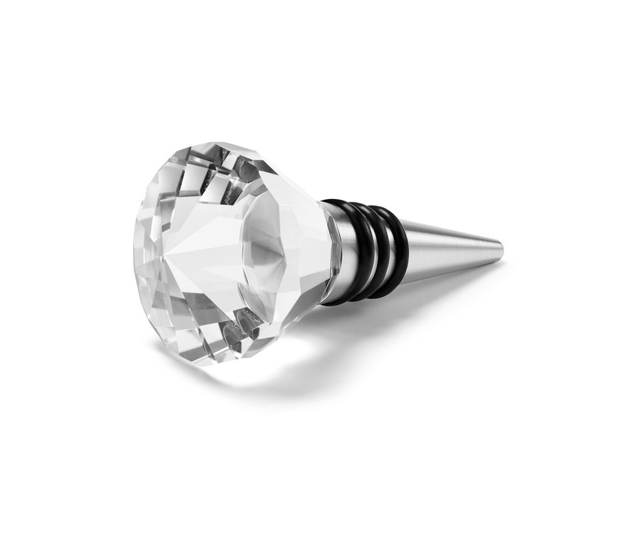 Egy nemesacél palackdugó üveg dísszel az asztalon.