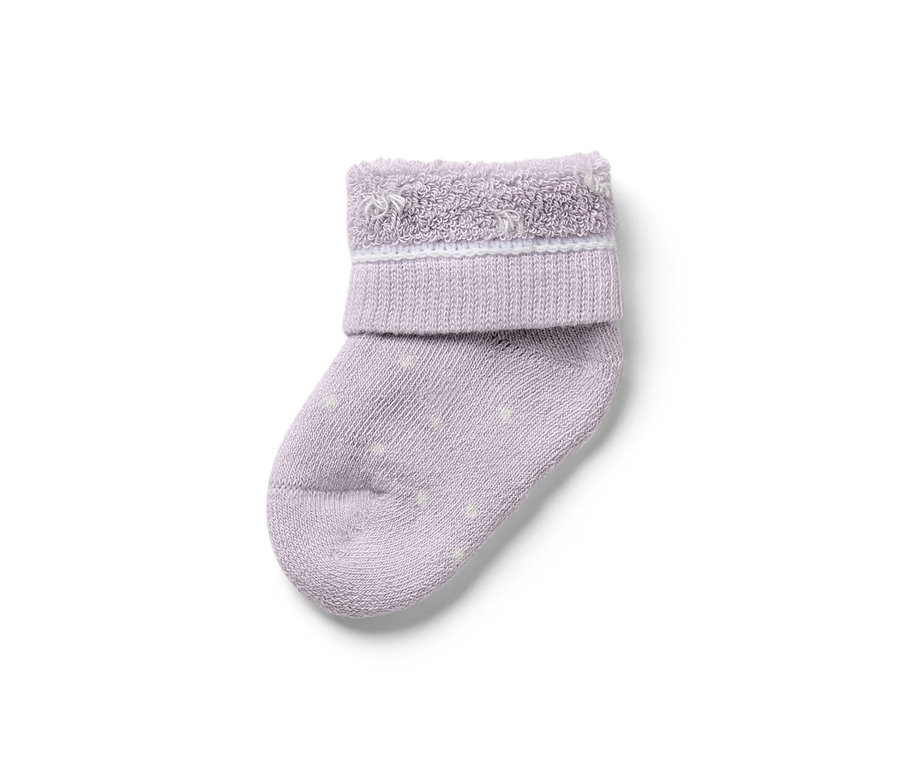 Egyetlen lila babazokni fehér pöttyökkel, 7 pár babazokni, hattyús.