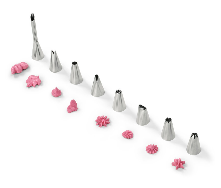 Díszítőcsövek rózsaszín cukormázzal fehér háttéren.