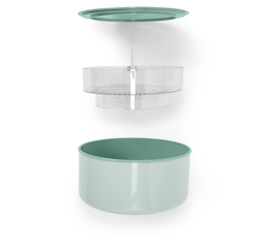 Szétrobbantott ábra egy zöld fedővel, átlátszó betéttel és világoszöld tartállyal rendelkező élelmiszertároló edényről.