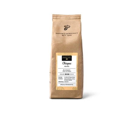 Barna kávéscsomag „Rarität Chiapas Mexiko - 500 g szemes kávé”, sárga címkével, mely ízjegyeket és intenzitást mutat.