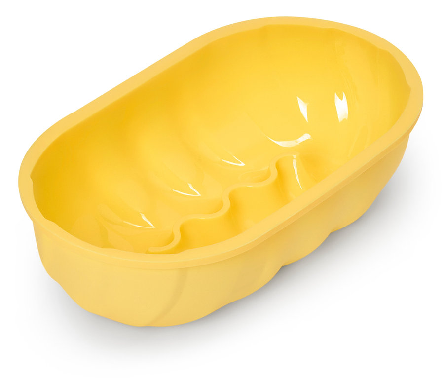 Sárga, ovális tortaforma hullámos aljjal.