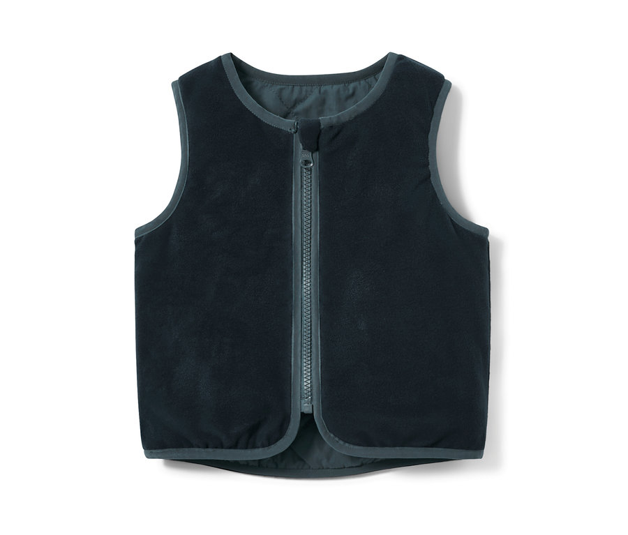 Egy sötétkék, kifordítható, steppelt gyerek mellény középen cipzárral.