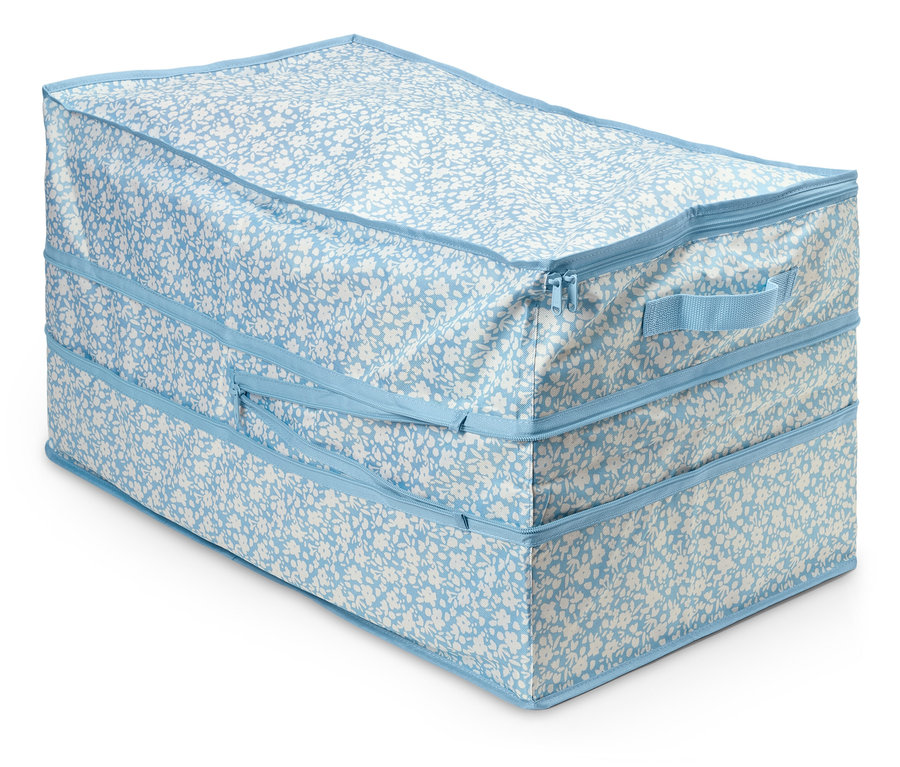 Nagy méretű tárolózsák kék-fehér virágmintával és cipzárral.