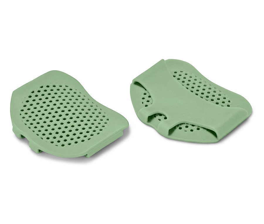 Két zöld szilikon betét perforált felülettel.