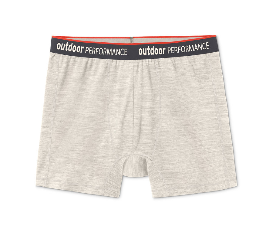 Egy világosbézs színű 2 férfi boxer alsónadrág, merinó szürke színben, fekete színű "Outdoor Performance" felirattal.