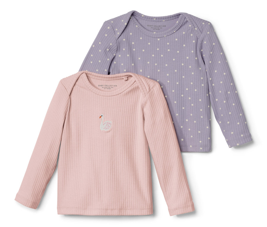 Két hosszú ujjú, bordázott babafelső; egy rózsaszín, hattyúrátéttel, és egy lila, pöttyös.