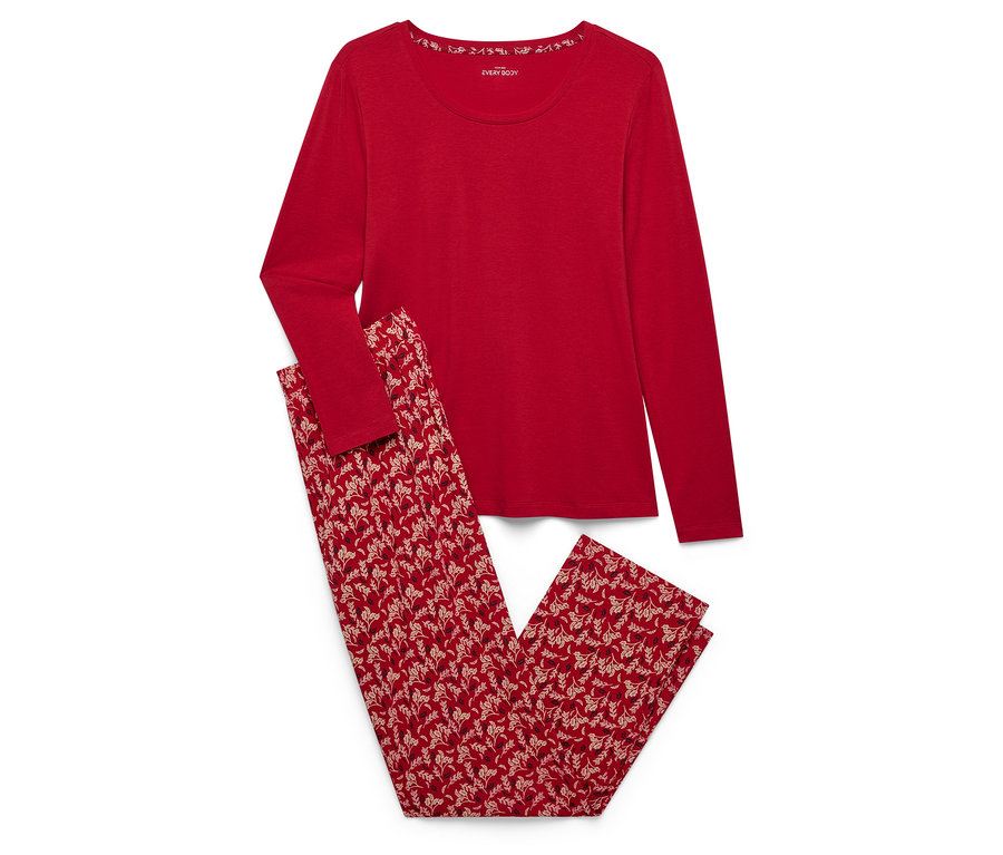 Piros, hosszú ujjú pizsama virágos nadrággal.