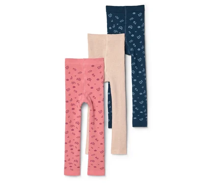 Három gyerek leggings: rózsaszín mintás, bézs és sötétkék mintás, egymáson fekszenek.