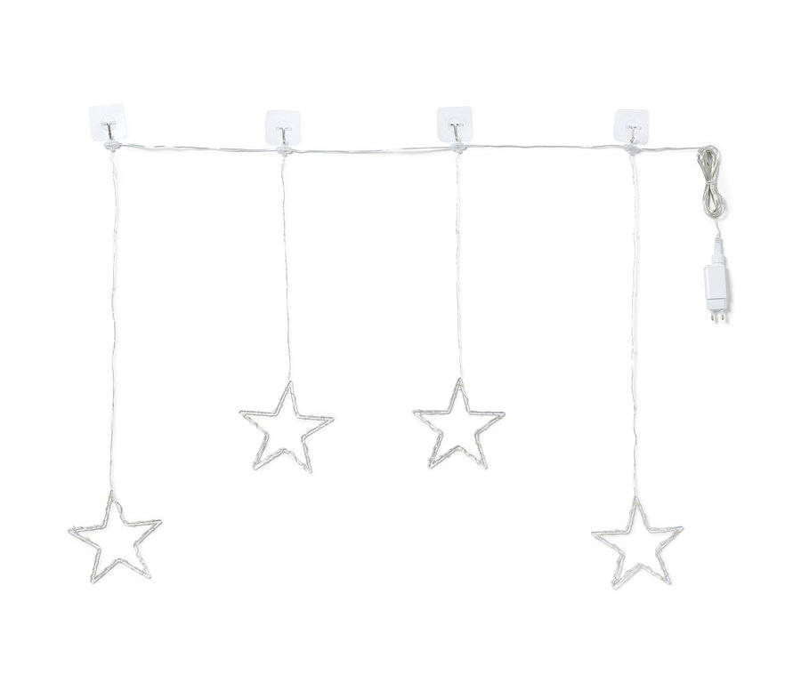 Négy LED-es világító csillag lóg egy LED-es fényfüggönyön.