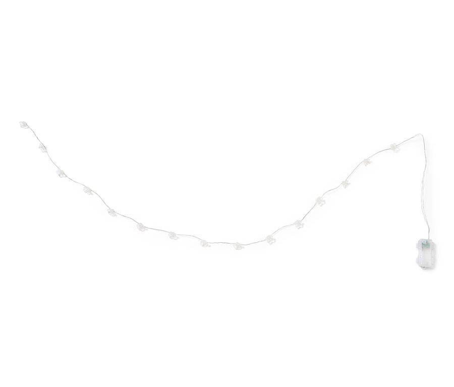 Virágos mikro LED-es fényfüzér fehér háttérrel.