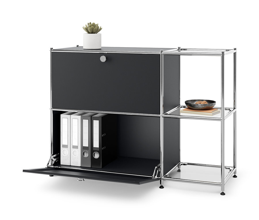 Fekete »CN3« fém komód 2 lenyíló ajtóval, egy növény a tetején és iratgyűjtők belül.