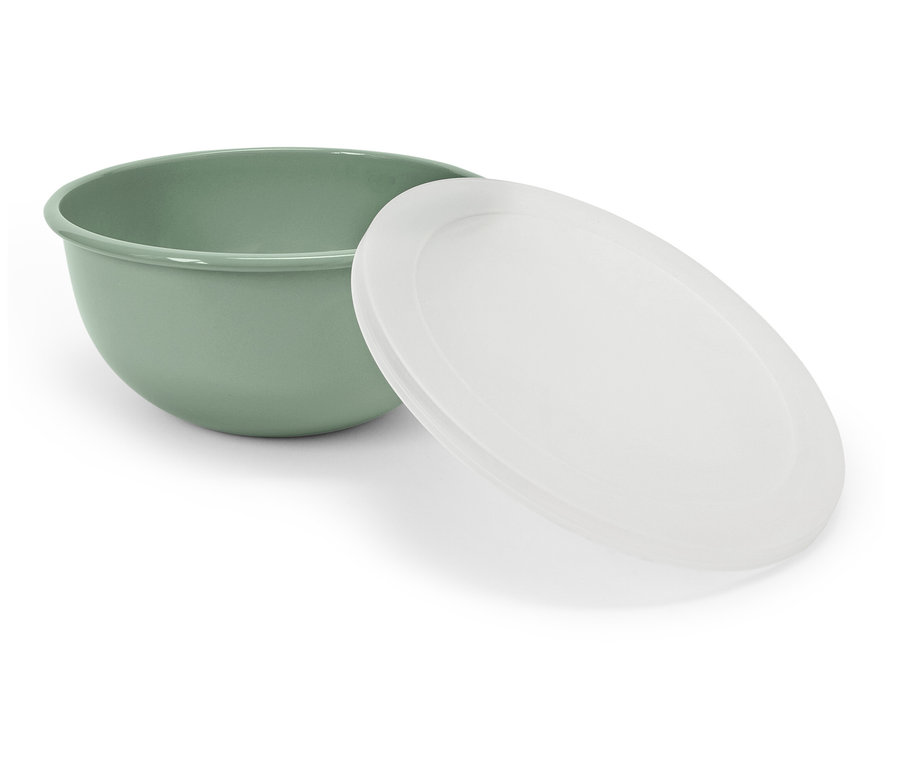 Egy zöld tál egy fehér fedővel mellette.