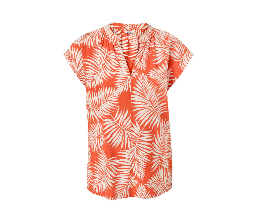 Narancssárga, rövid ujjú blúz levélmintával.