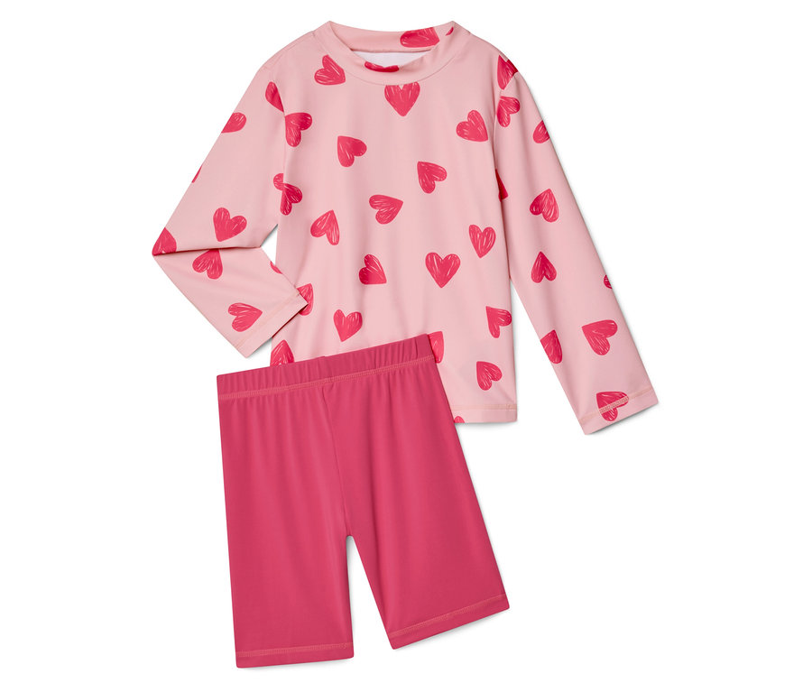 Rózsaszín, szívmintás, hosszú ujjú felső és rózsaszín rövid leggings.