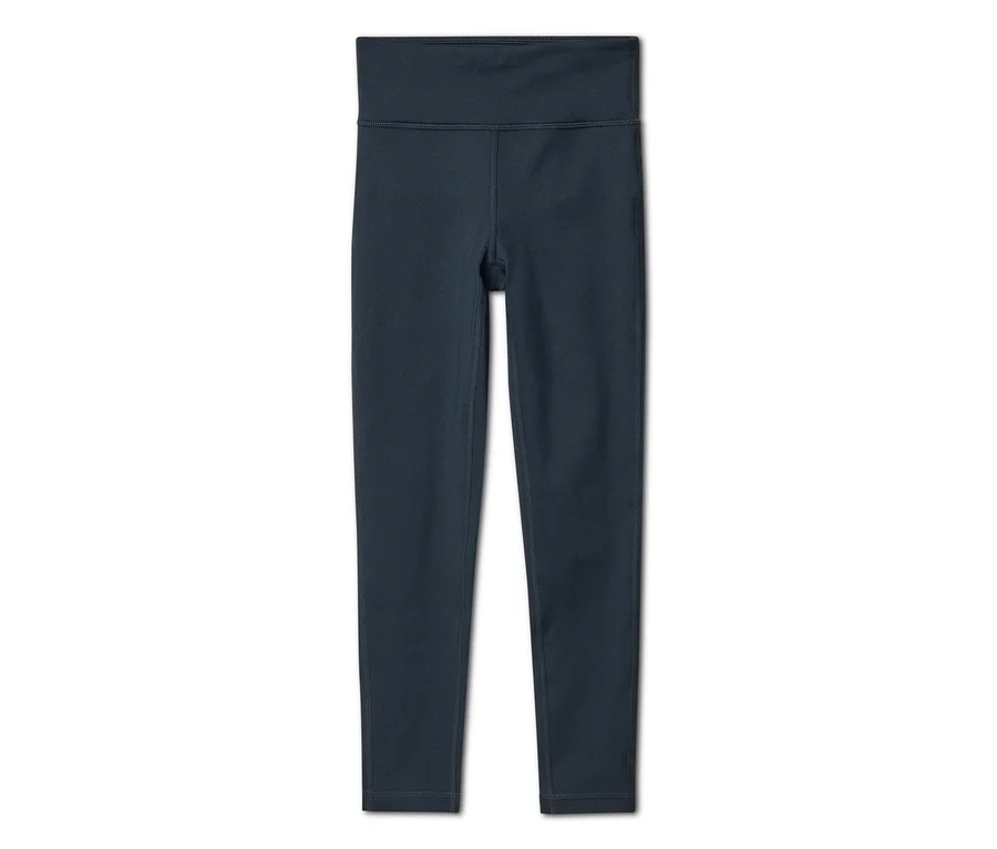 Sötétkék magas derekú leggings, laposan fektetve fehér háttéren.