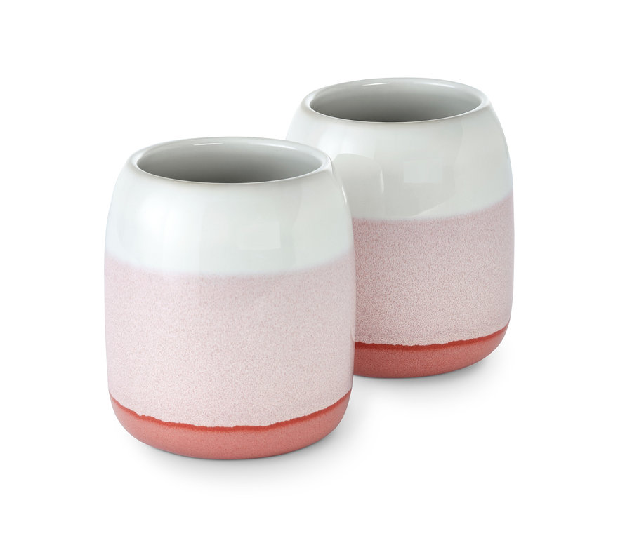 Két fogkefetartó pohár fehér felsőrésszel és rózsaszín alsórésszel.