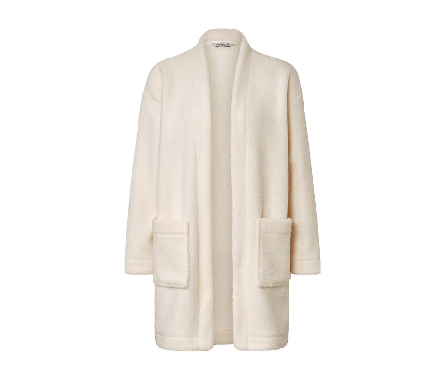 Világos plüsskabát zsebekkel.