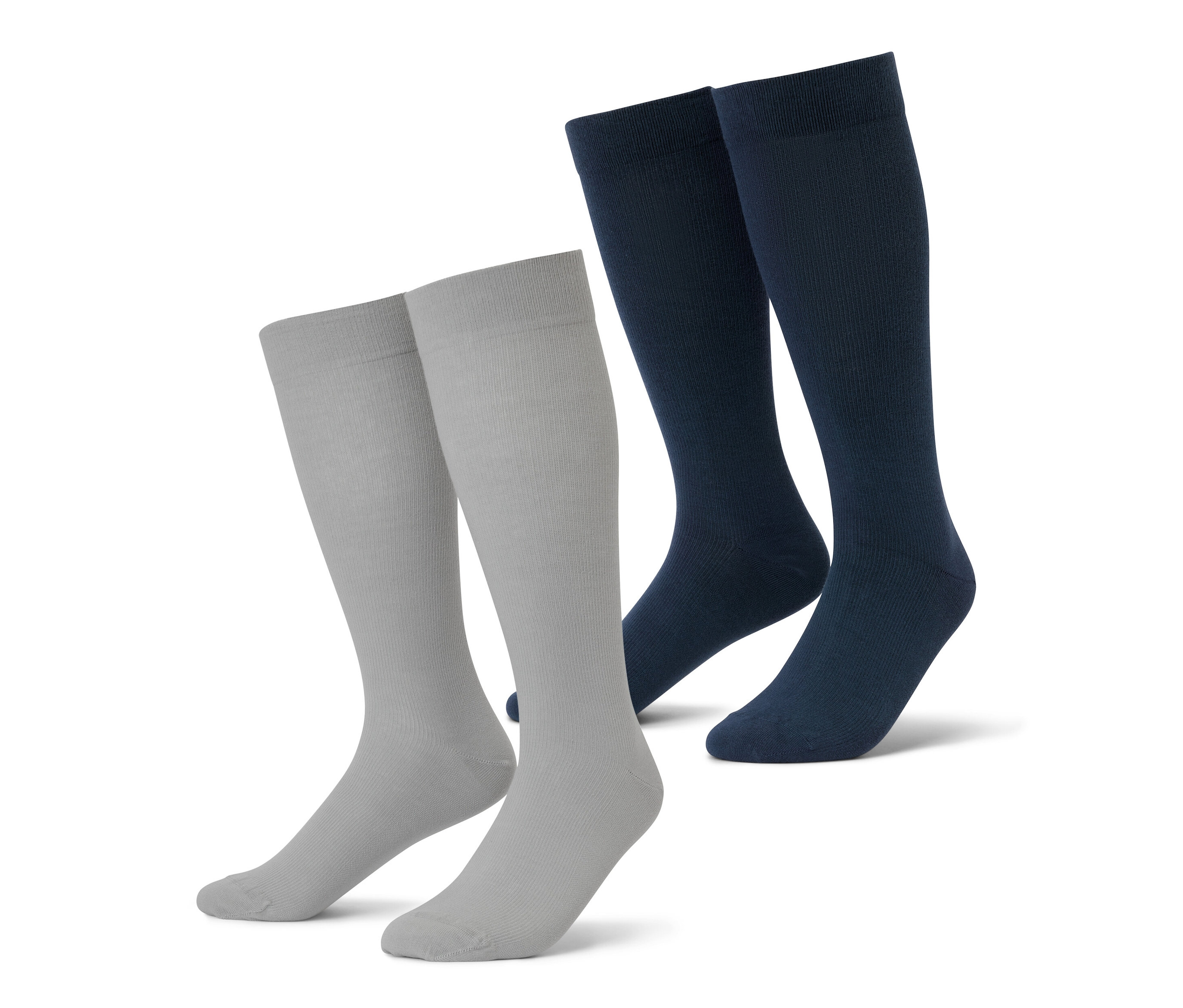 Két pár szürke és sötétkék kompressziós zokni utazáshoz.