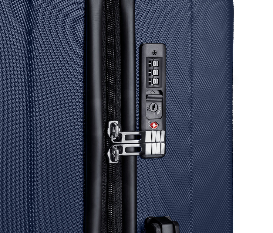 Nagy keményfedeles bőrönd részlete egy bőröndszettből.