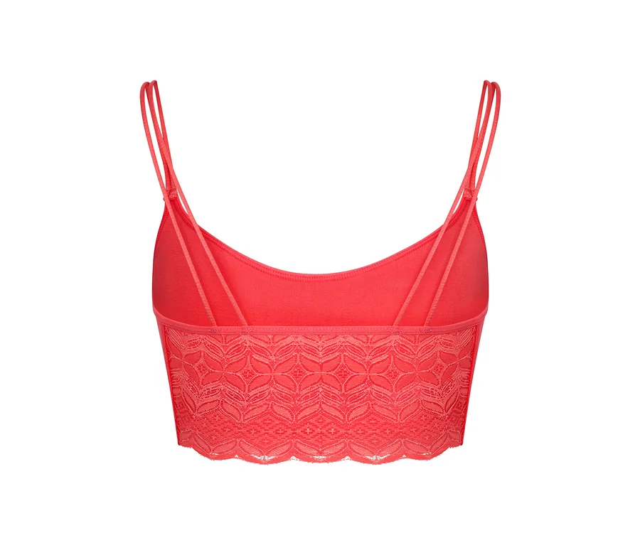 Egy korall színű, varrás nélküli, csipkés bustier hátulnézete.