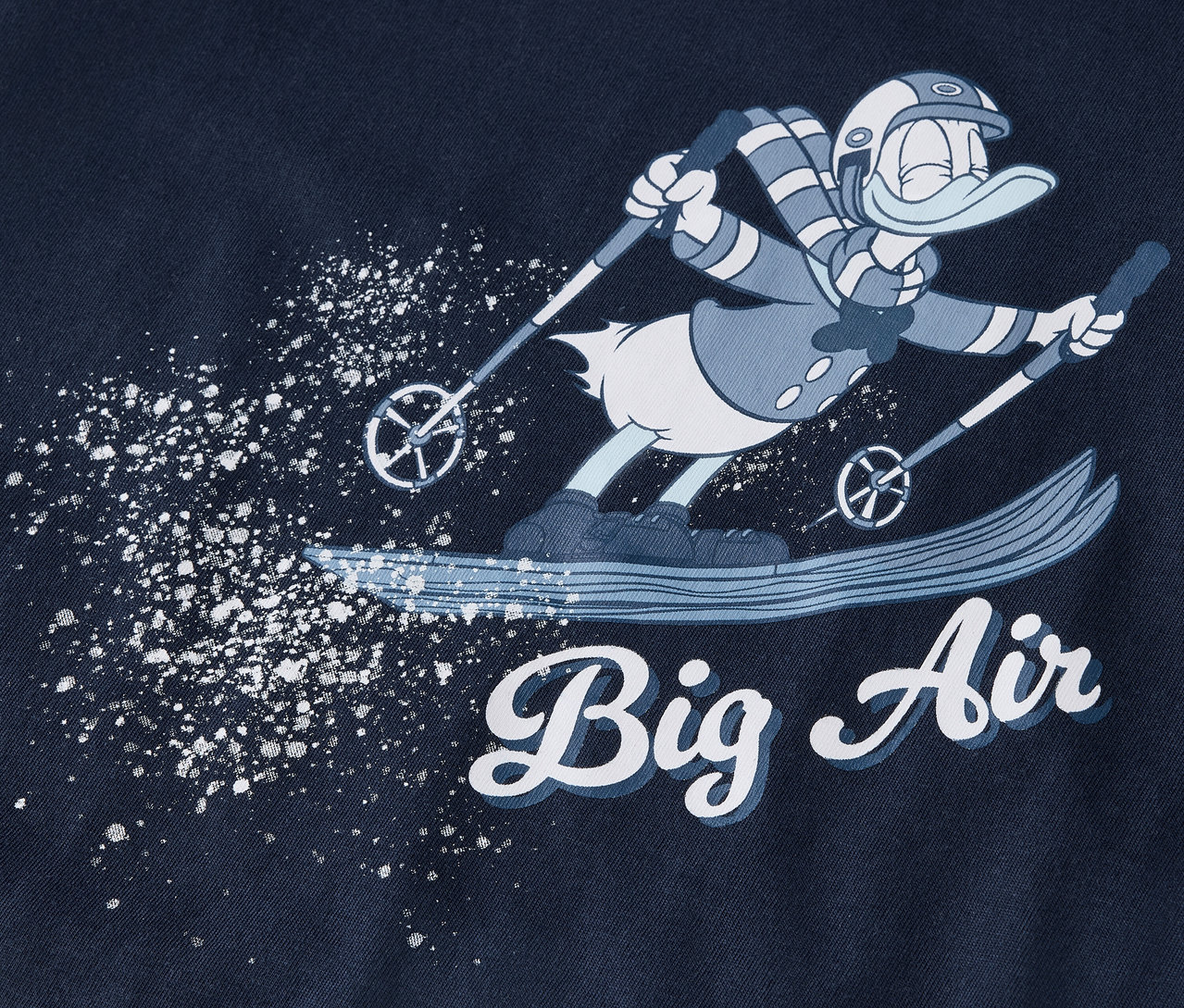 Rajzfilmfigura síel, hóval permetezve, alatta a "Big Air" felirat.