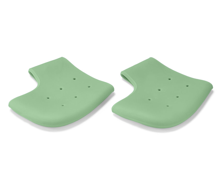 Két világoszöld szilikon sarokvédő lyukakkal, fehér háttéren.