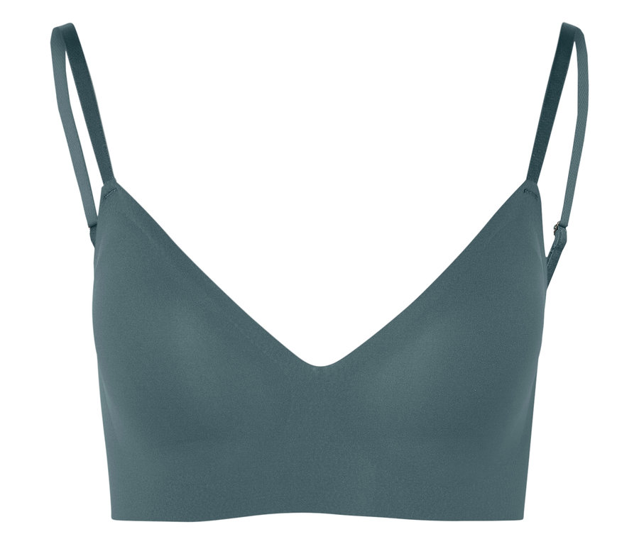 Egy türkiz színű spagettipántos melltartó közeli felvétele.