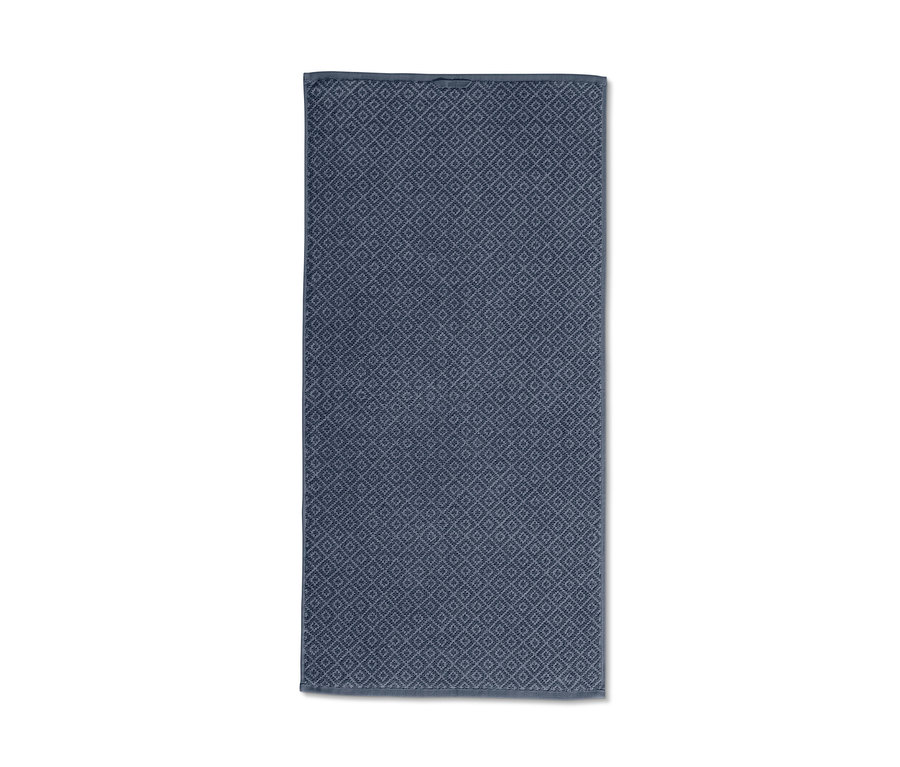 Kék, geometrikus mintás jacquard törölköző.