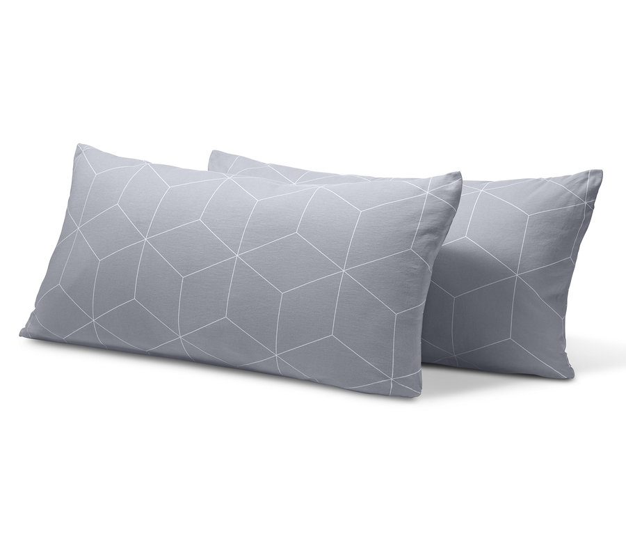 Két szürke, geometrikus mintás jersey párnahuzat.
