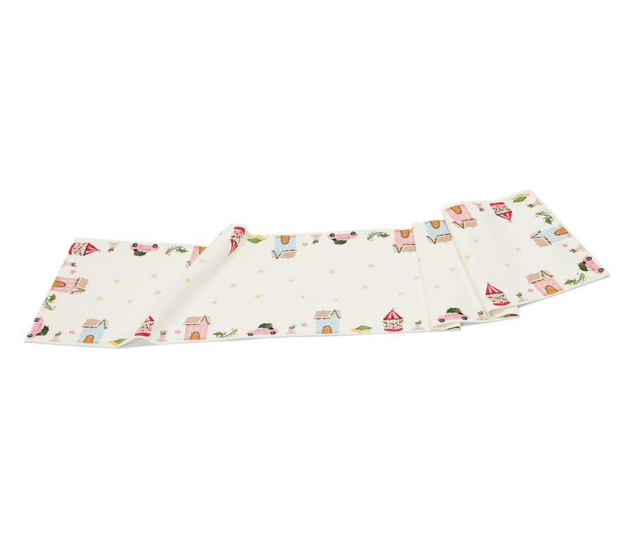 Egy fehér szövetcsík rajzolt házakkal, autókkal és csillagokkal.
