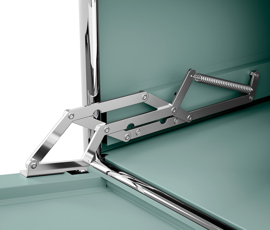 Egy zöld doboz nyitószerkezetének részlete.