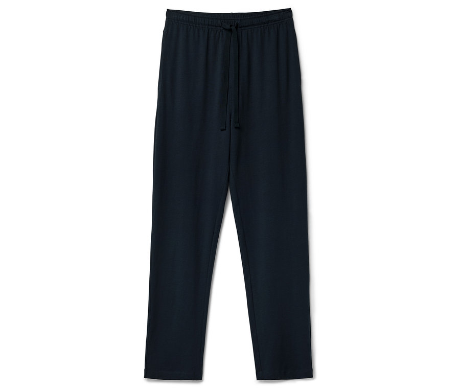 Egy sötétkék színű, húzózsinóros tréningnadrág fekszik egy fehér háttéren.