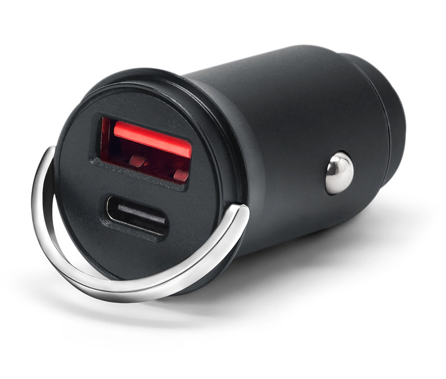 Fekete USB töltő két porttal és ezüst gyűrűvel, fehér háttérrel.