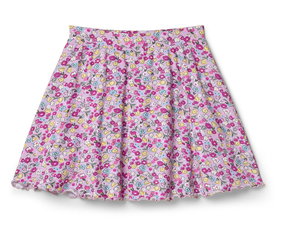Egy rózsaszín virágmintás, bővülő szoknya fekszik egy fehér háttéren.