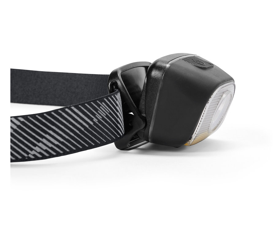 Egy fekete fejlámpa közeli képe csíkos pánttal.