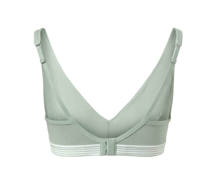 Hátulnézet egy világoszöld puha melltartóról, fehér csíkokkal az alsó szegélyen.