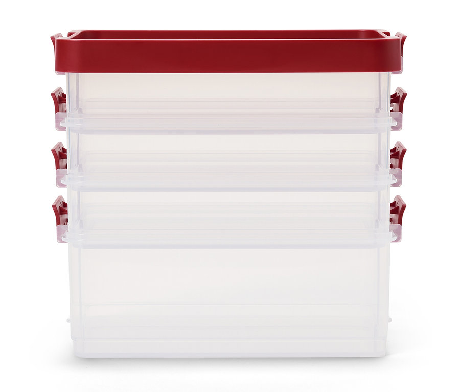 Három üres, átlátszó műanyag tárolódobozból álló halom fedővel és piros kapcsokkal.