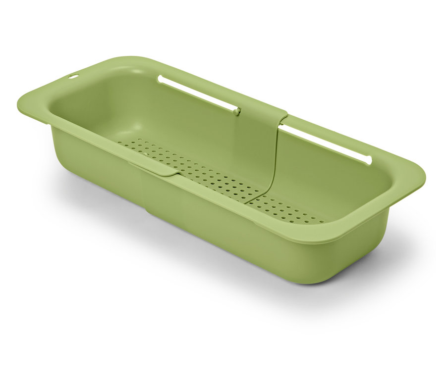 Zöld, kihúzható mosogatótálca fehér háttérrel.