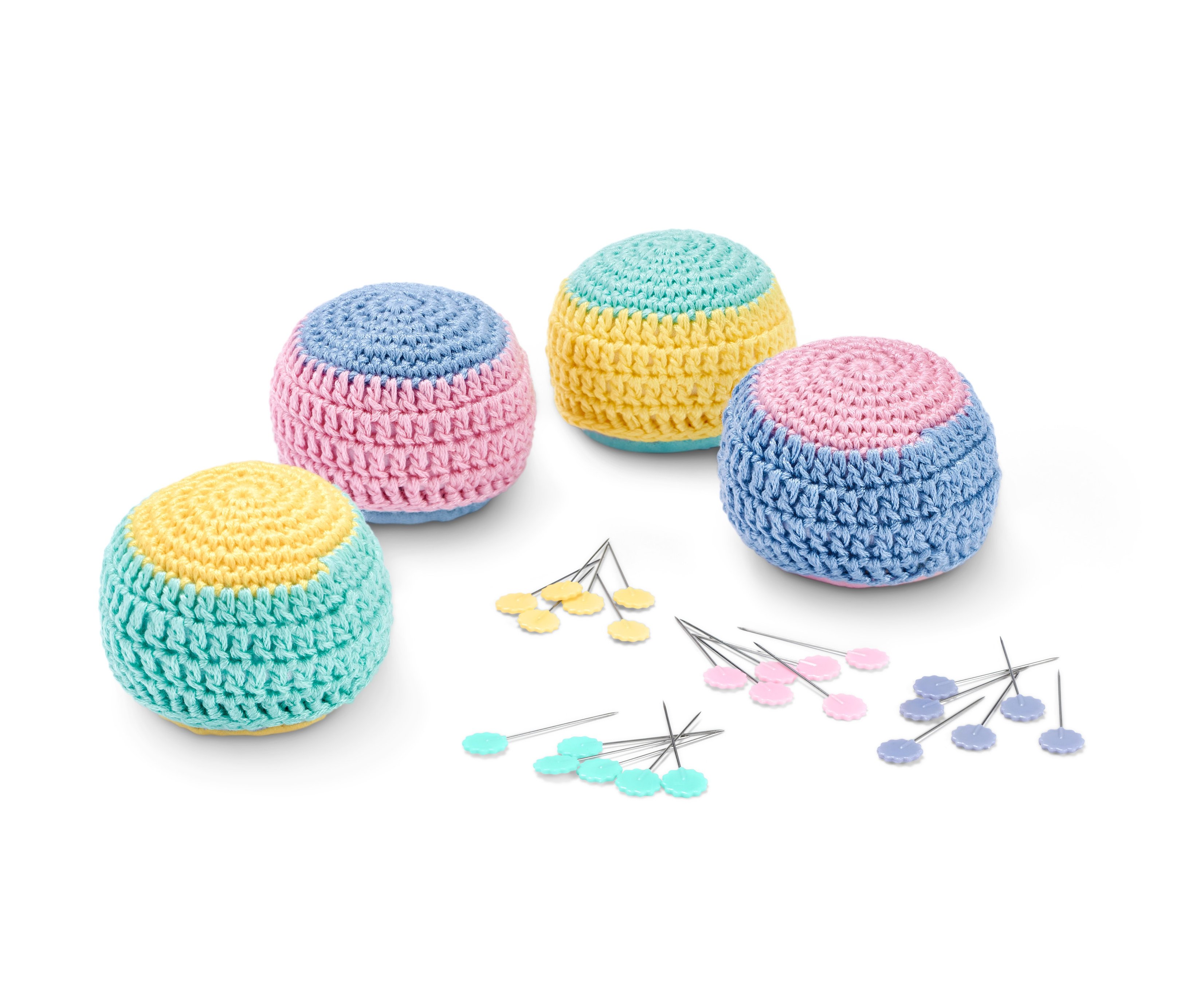 Négy pasztell színű kötött labda és 2 pár szabásminta nehezék szettben.