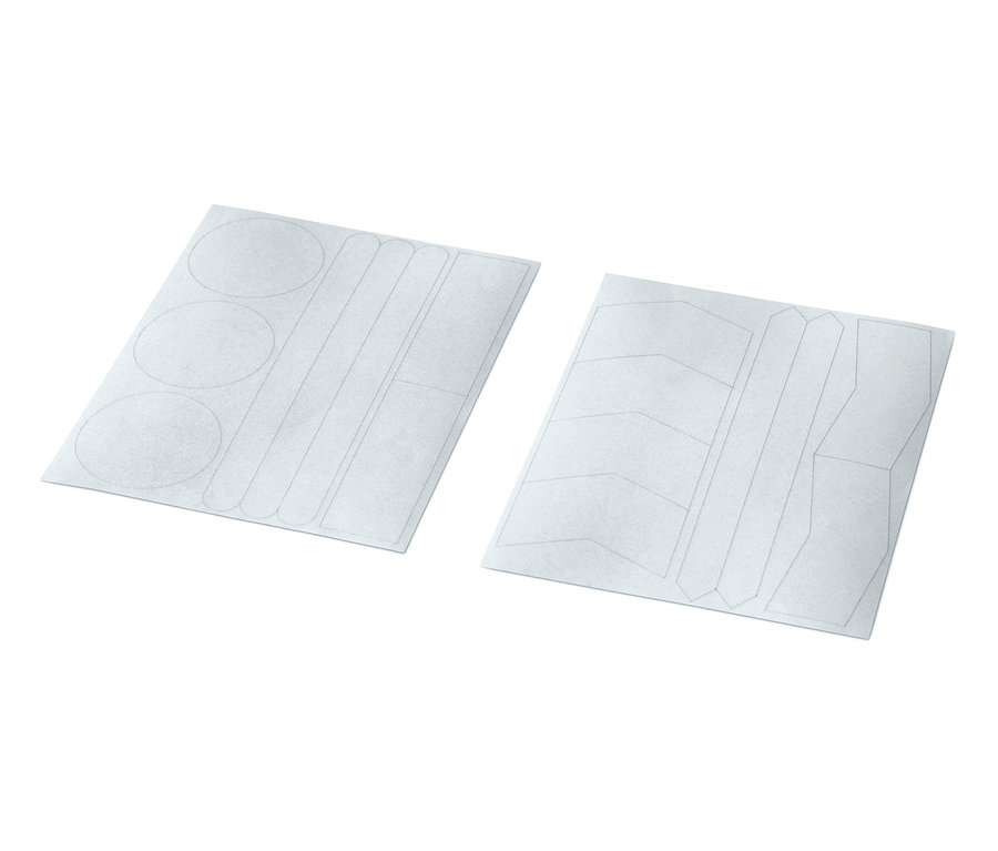 Két ív fényvisszaverő matrica, összesen 16 darab, különböző formákkal.