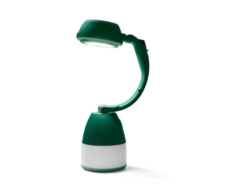 Egy zöld multifunkciós kempinglámpa, amely felfelé irányított fényt.