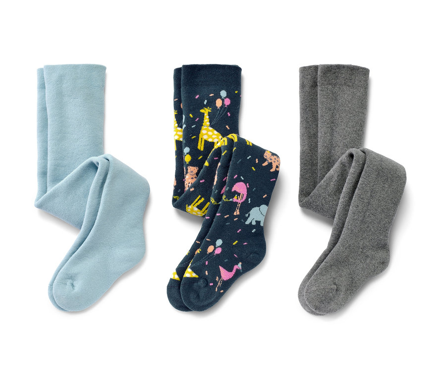 A képen három kisgyerek termoharisnya látható: egy világoskék, egy sötétkék, állatmintás és egy szürke.