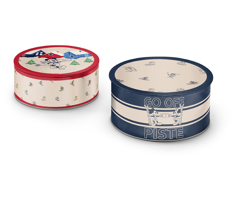 Két kerek fémdoboz különböző mintákkal és színekkel.