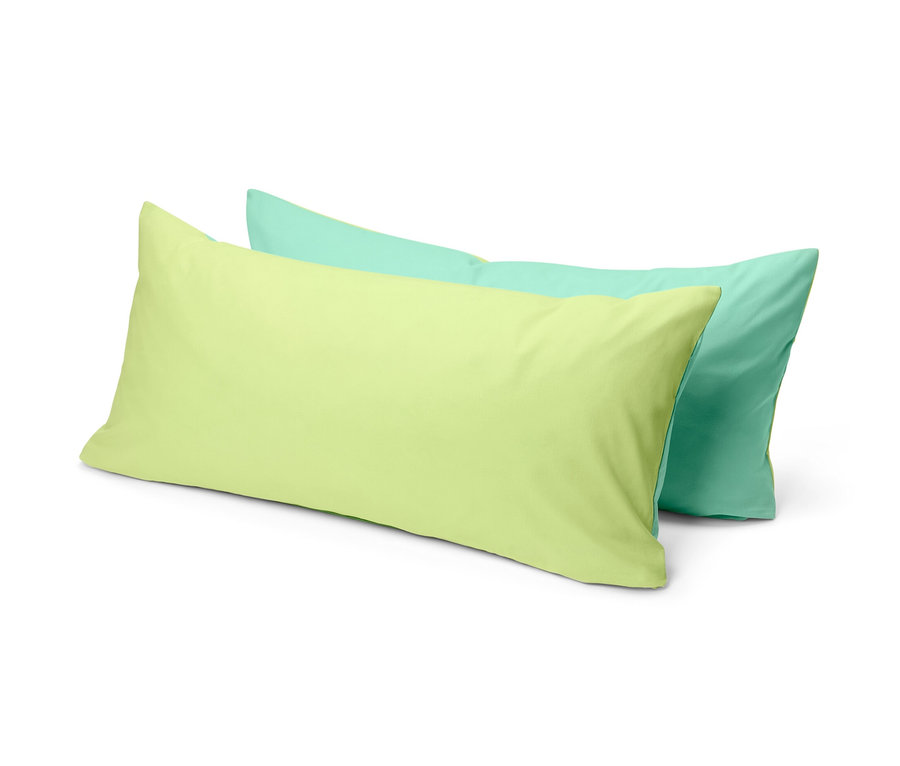 Két sárga és zöld renforcé párnahuzat egymáson fekszik.
