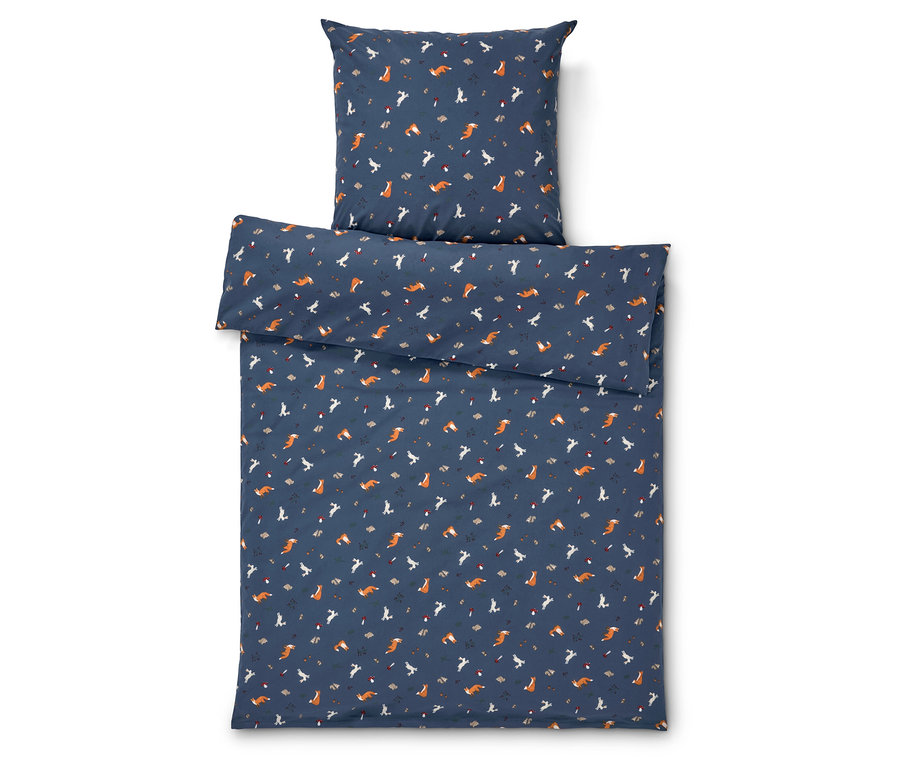 Ágynemű róka mintával, kék háttéren.