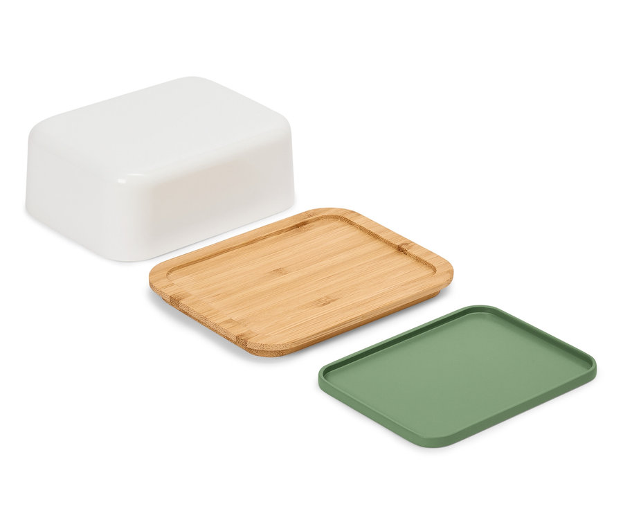 Fehér alapon egy fehér tartály, egy fa tálca és egy zöld tálca fekszik.